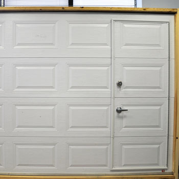 White garage door with pass-through door